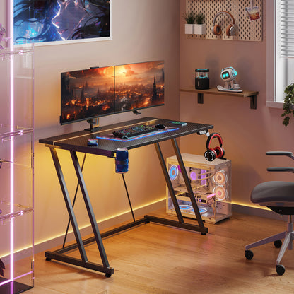 31.5 inch Gaming Desk with Z-Leg Design, Computer Desk with LED Light & Power Outlet, Gaming Table Suitable for Small Space, Black