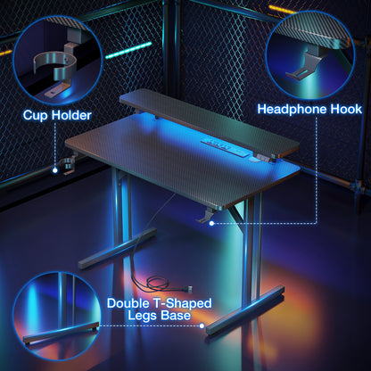 Gaming Desk 31 INCH, T- Shaped Carbon Fiber Surface Computer Desk with Full Desk Mouse Pad, Gamer Desk with Double Headphone Hook, USB Gaming Rack, Cup Holder, Black